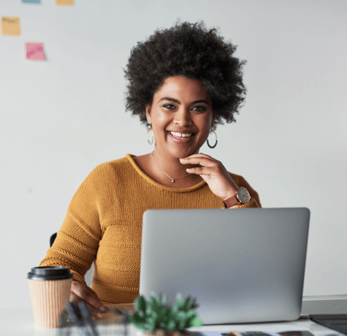 Happy woman working on computer