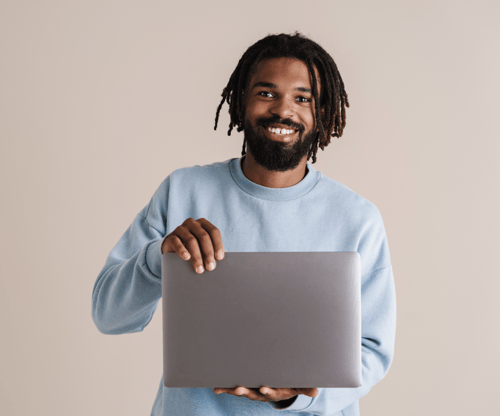 Employee working on laptop happy